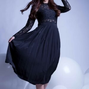 Eterna long black dress with lace sleeves and a pleated skirt.